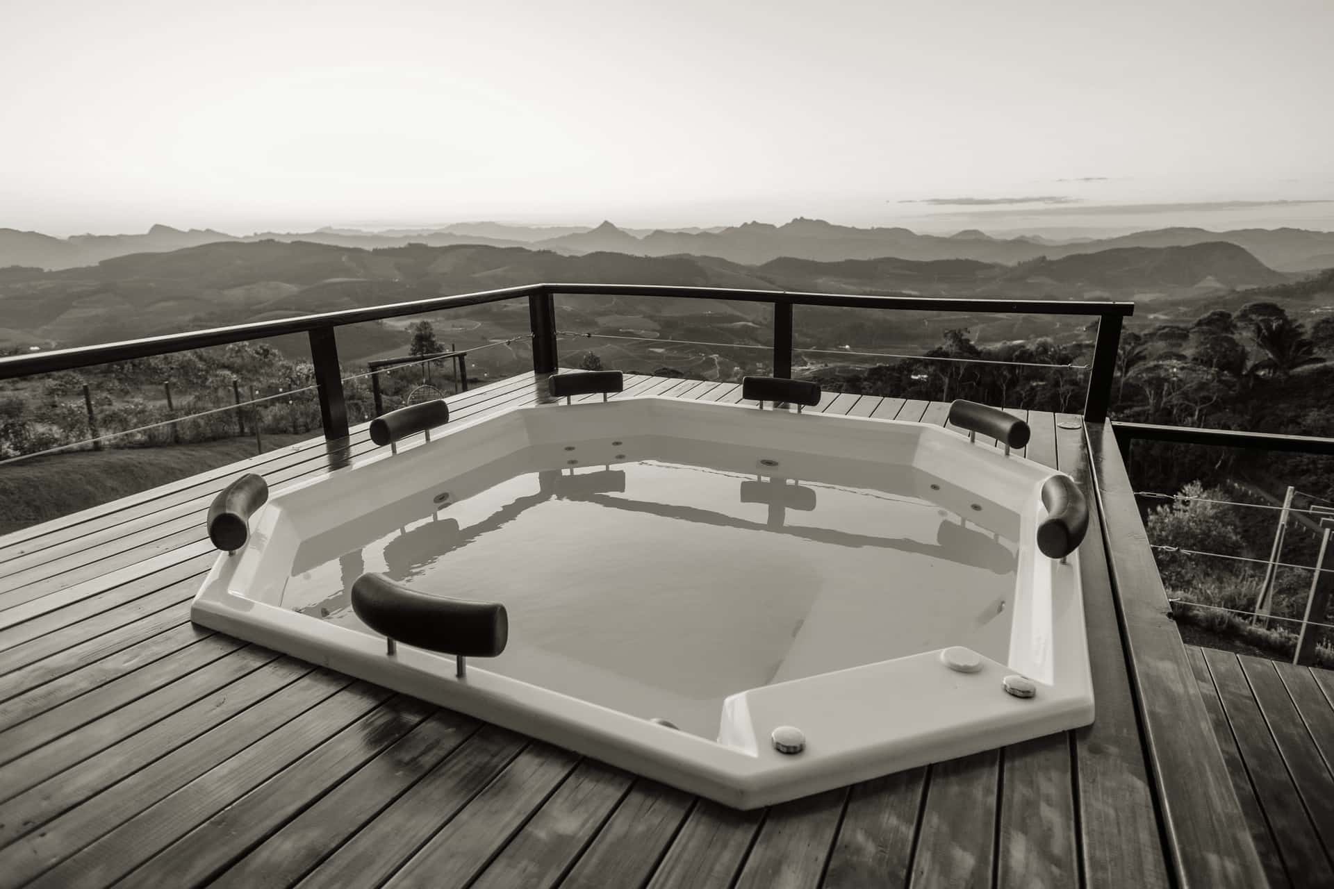 Simple outdoor tub setup on a wooden deck