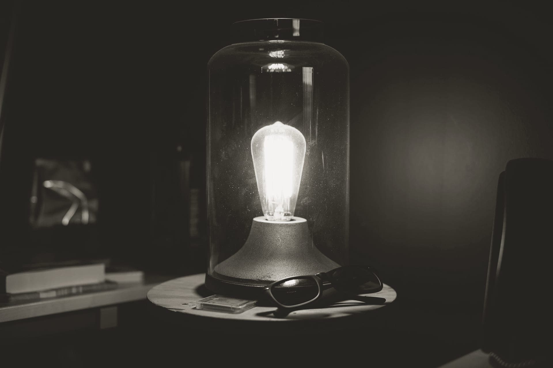 Warm lamp glow against a dark background