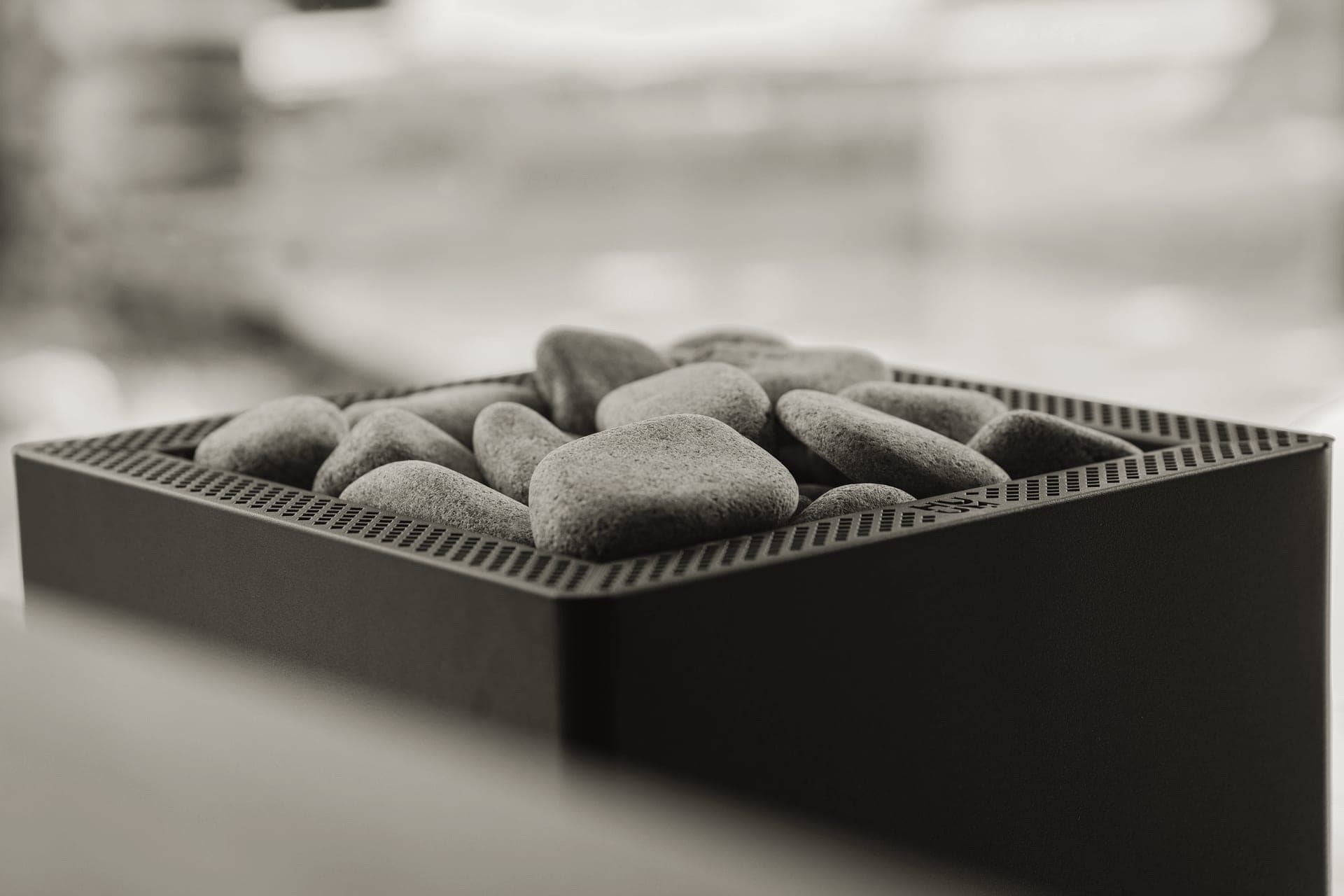 Sauna heater with glowing hot stones